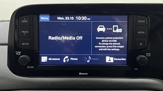 Used 2022 Hyundai Grand i10 Nios Sportz 1.2 Kappa VTVT Dual Tone Petrol Manual top_features Integrated (in-dash) music system